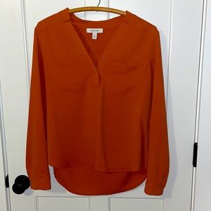 Beautiful burnt orange v neck blouse